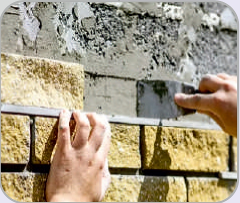 Stone adhesive application on construction site