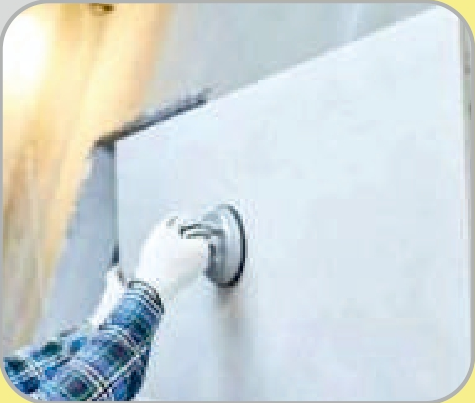 Tile adhesive application on wall